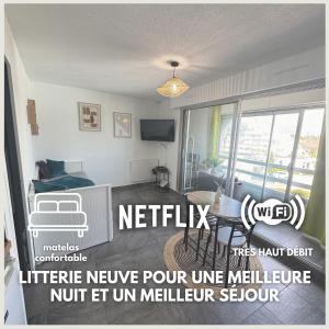 TV a/nebo společenská místnost v ubytování Havre de Sable - WIFI - Plage 250m - Centre ville à proximité - Pas de parking mais gratuit dans la rue