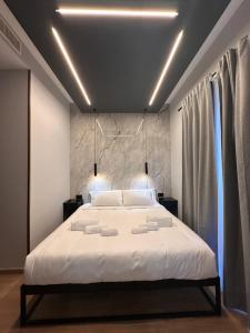 Eterna Suites Roma客房内的一张或多张床位