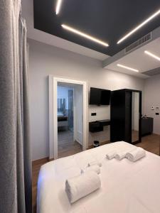 Eterna Suites Roma客房内的一张或多张床位
