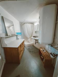 a bathroom with a counter and a sink in it at Central city apartment with terrace in St. Gallen +26 photos