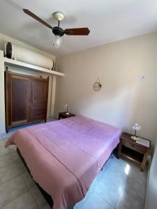 Postel nebo postele na pokoji v ubytování Apartamento no Guarujá + 10 fotografií