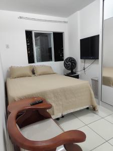 Et tv og/eller underholdning på Apartamento Dois Quartos - Garagem - Localização excelente em Brotas + 17 billeder