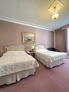 Hotel Alameda Grand客房内的一张或多张床位