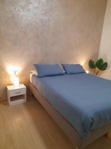 A bed or beds in a room at Appartamento Carducci Fiera Rho Milan