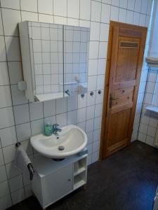 a bathroom with a sink and a mirror at Ferienwohnung in Ehrenbreitstein in Koblenz +19 photos