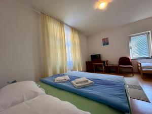 Postel nebo postele na pokoji v ubytování Wellness & Spa - Hotel Oaza