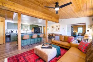 a living room with a couch and a kitchen at Breathtaking Views Elevated Comfort Pets Welcome in Prescott
