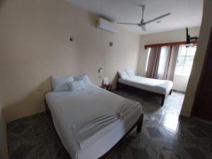 Ένα ή περισσότερα κρεβάτια σε δωμάτιο στο Hotel María José +2 φωτογραφίες