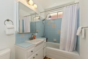 a bathroom with a sink and a tub and a shower at Lake Gregory Skyline Ridge in Crestline +42 photos