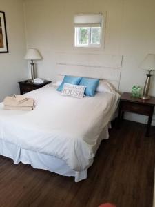 Ένα ή περισσότερα κρεβάτια σε δωμάτιο στο Westlake Picton Cottage