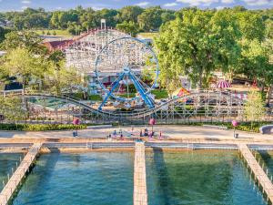 an amusement park with a ferris wheel and water at Rockn Reel on East Lake Okoboji in Spirit Lake