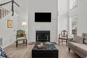 a living room with a couch and a fireplace at Pinehurst Manor 2BR Townhome in Pinehurst