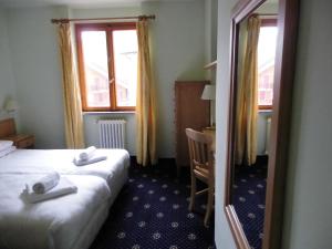 Postel nebo postele na pokoji v ubytování Hotel Residence Valverde