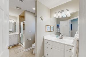 a white bathroom with a sink and a toilet at Town of Bethany Beach -116 Oakwood St in Bethany Beach +39 photos