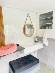 a bathroom with a sink and a mirror at Espaço Varanda in Sao Paulo