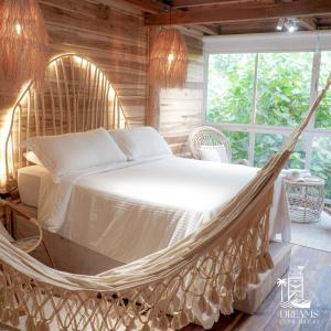 Ένα ή περισσότερα κρεβάτια σε δωμάτιο στο Habitacion Luxury Origen en Playa Mendihuaca, a 10 Min del Parque Tayrona