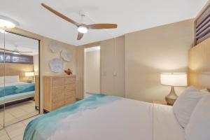 a bedroom with a bed and a ceiling fan at Kuleana Club #510 - Ocean View -1 bedroom & 1 bathroom - 2nd Floor in Kahana