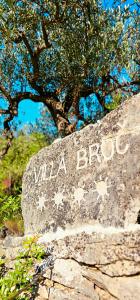a rock with the words visa brook written on it at Villa Broč in Postira
