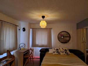 Postel nebo postele na pokoji v ubytování Vacances en tout tranquillité à Vercorin