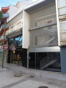 a store front of a building on a city street at Apartamento Zepeling by Hr Costabrava in Platja  d'Aro