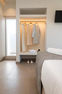A bed or beds in a room at Depalyma Suites