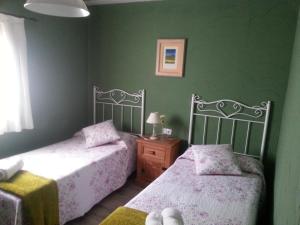 A bed or beds in a room at Albergue San Pelayo