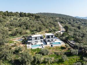 an aerial view of a house in the middle of a hill at Villa Nefeli in Meganisi
