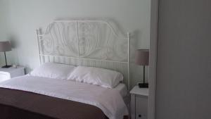Кровать или кровати в номере La Rosa dei Venti