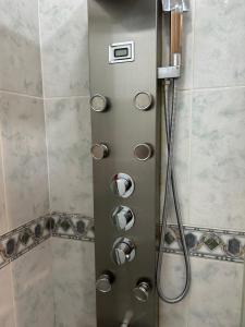 a shower door with a shower head in a bathroom at Centrico tu hogar en Bilbao in Barakaldo +23 photos