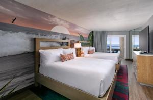 a hotel room with two beds and a tv at The Wayfarer San Diego in San Diego +37 photos