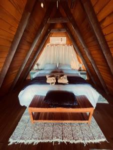 En eller flere senge i et værelse på Cabana Alpina Ibitipoca