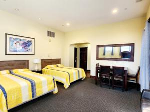 Katil atau katil-katil dalam bilik di Santa Paula Inn