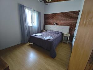 Ένα ή περισσότερα κρεβάτια σε δωμάτιο στο Alborada +9 φωτογραφίες