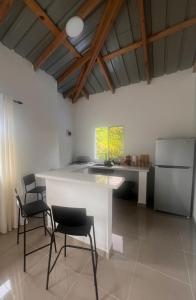 a kitchen with a table and chairs in a room at Apartamento Media Luna in Cabrera