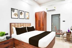Postel nebo postele na pokoji v ubytování Hotel O Global