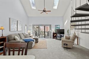 a living room with a couch and a ceiling fan at 34j GCR-Ortiz Oasis in Myrtle Beach