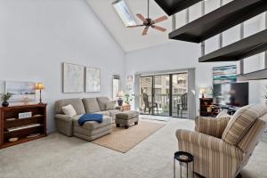 a living room with a couch and chairs and a tv at 34j GCR-Ortiz Oasis in Myrtle Beach