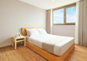 Postel nebo postele na pokoji v ubytování Hanwha Resort Gyeongju