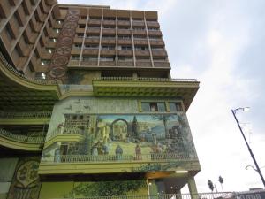 a building with a mural on the side of it at Agas Holiday Apartments Family in Tiberias