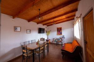 a dining room with a table and chairs at Casa Sutar Las Higueras in San Pedro de Atacama
