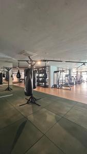 a gym with a helicopter in the middle of a room at Apartamento charmoso com Rooftop in Salvador +25 photos