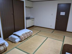Letto o letti in una camera di Tabist Business Hotel Kaigansou Gamagori