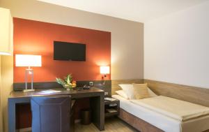 Postel nebo postele na pokoji v ubytování Hotel Holl