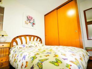 Posteľ alebo postele v izbe v ubytovaní Apartamento