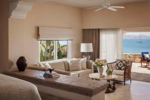 a living room with a couch and a table at One&Only Palmilla in San José del Cabo