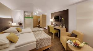 Postel nebo postele na pokoji v ubytování Hotel Holl