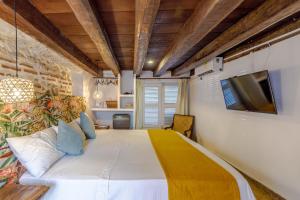 Postel nebo postele na pokoji v ubytování Bololá Hotel