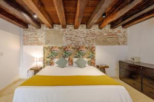 Postel nebo postele na pokoji v ubytování Bololá Hotel