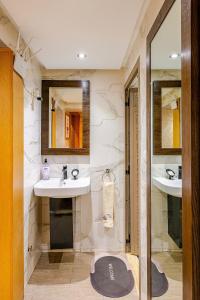 a bathroom with two sinks and a mirror at Good vibes - Rabat - Medina in Rabat