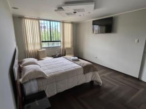 Postel nebo postele na pokoji v ubytování Hotel Douce Nuit